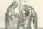 Two witches brewing a spell in a cauldron