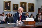 The Honorable Russell Vought, Director of the Office of Management and Budget speaks in front of a committee. Behind him is an audience with old portrait on the wall.