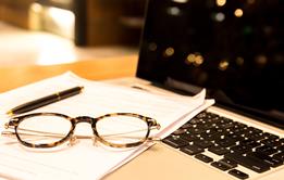 A photograph of an journal article on an office desk