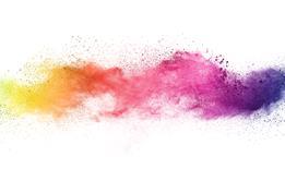 A splash of colourful powder pigments on a white background