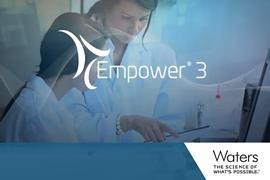 Two researchers look at data in a notebook - the software name Empower 3 is superimposed