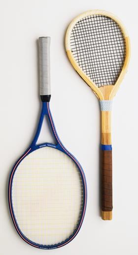 An image showing a comparison between a modern and an old tennis racket