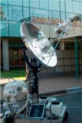 A solar-powered autoclave - a metallic device with a large dish to concentrate sunlight onto a central sterilising unit