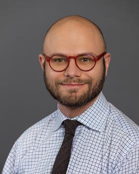 Headshot of Julian Silverman, chemist and educator teaching cosmetic and material science at the Fashion Institute of Technology in New York City.