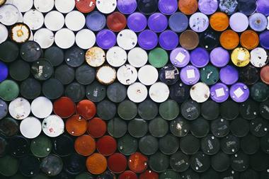 An aerial view of many colourful petroleum barrels