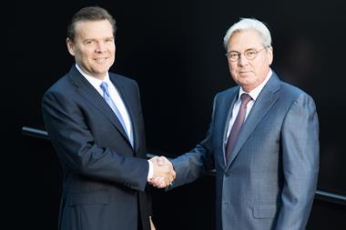 Hariolf Kottmann, CEO of Clariant, shaking hands with Peter Huntsman, President and CEO of Huntsman