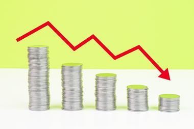 Decreasing piles of coins and red downward arrow