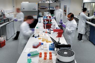 Scientists in motion working in a laboratory
