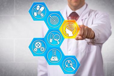 A drug discovery concept image, showing a man in a labcoat interacting with digital 'tiles that represent different parts of the process'