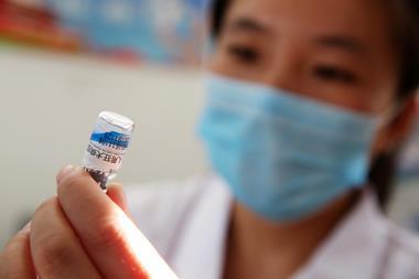 A photograph of a nurse preparing a vaccination shot against rabies at the Disease Control and Prevention Center in Huaibei in China's eastern Anhui province