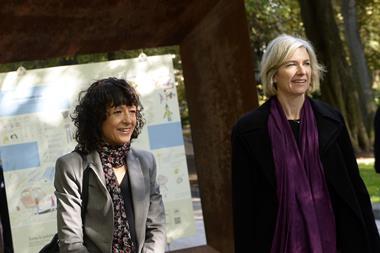 Emmanuelle Charpentier (L) and Jennifer Doudna walking in a park