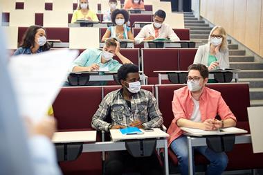 An image showing students in a lecture theatre wearing masks