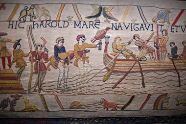 Bayeux medieval tapestry featuring embrodered scenes of battle