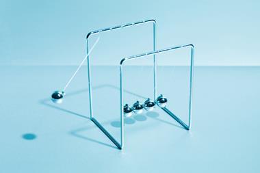 An image showing Newton's cradle in motion