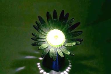 An artificial flower that opens when light is shined on it