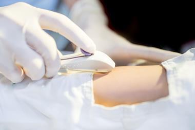 An image showing a doctor using a contraceptive implant on a woman's arm