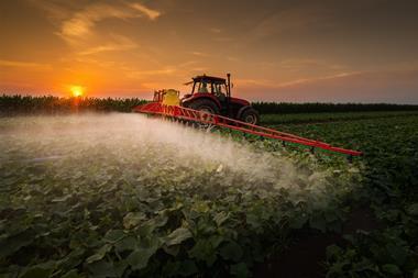 Tractor spraying pesticide