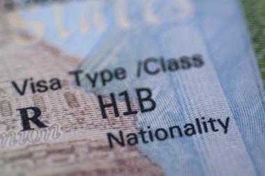 A close up of a H1B visa in a passport