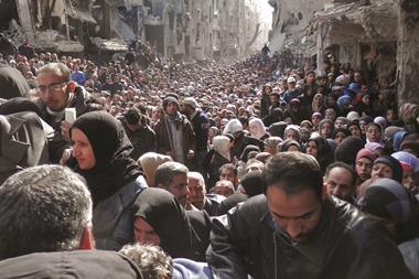 Residents in the Yarmouk refugee camp in Damascus, Syria - Hero