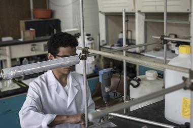 An image showing a student working inside the chemistry lab at the Simon Bolivar University campus in Caracas, Venezuela