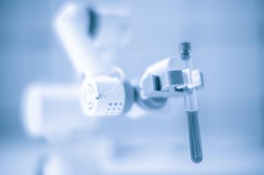 Robotic arm holding test tube