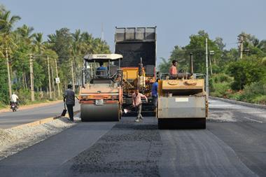 Labourers working at the construction site of a state highway road