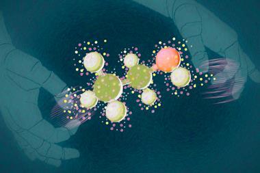 Computer hands holding molecule