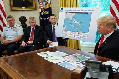An image showing President Trump receiving briefing on Hurricane Dorian at White House