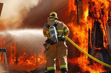 An image of a firefighter tackling a large blaze