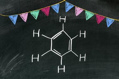 Benzene and bunting in chalk on a blackboard