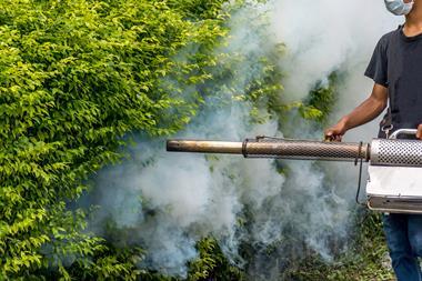 Man spraying DDT mosquito control