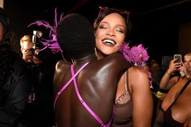 Rihanna hugging a model