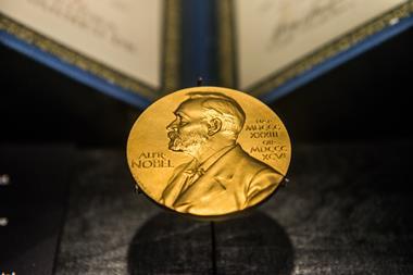 A golden image of the Nobel Prize decorates the front of the Science Museum in Singapore