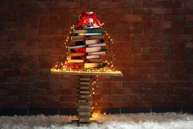 A Christmas tree structure made from a pile of books
