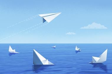 Paper boats sinking while paper plane flies off