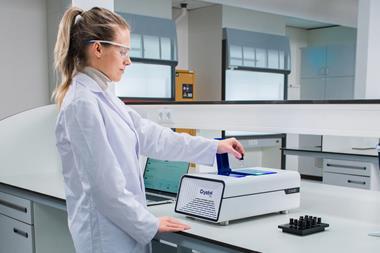 Photograph of a researcher using the Technobis Crystal16 in a laboratory