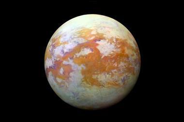 Saturn's moon Titan - showing the surface with red and white patches