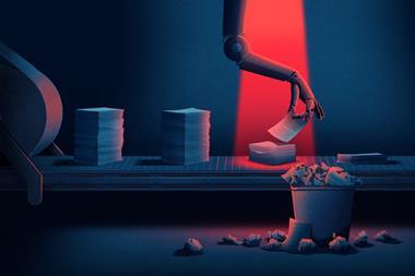 Robotic arm picking up paper from pile