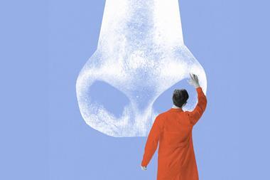 Scientist looking inside nose