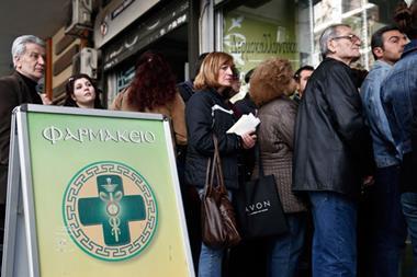 Greeks queuing outside a pharmacy