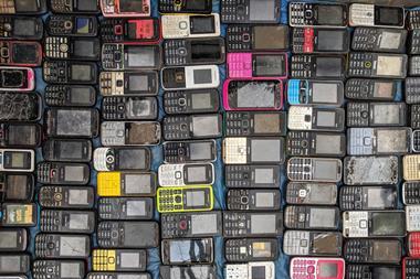 A picture showing lots of old mobile phones
