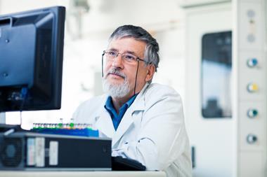Senior researcher using a lab computer