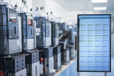 Laboratory with Waters Alliance iS HPLC systems and digital system monitoring display for real-time performance tracking