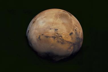 An image showing mars hanging in the pitch black of space
