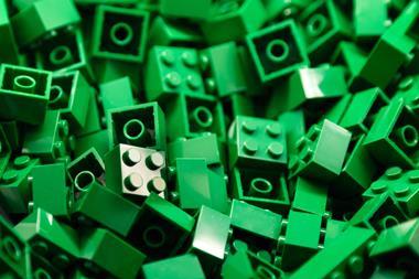Close-up of pile of small green lego bricks
