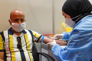 A photo of a man having a blood sample taken