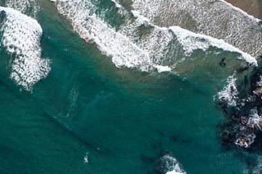 Ocean waves along the shoreline from an overhead view