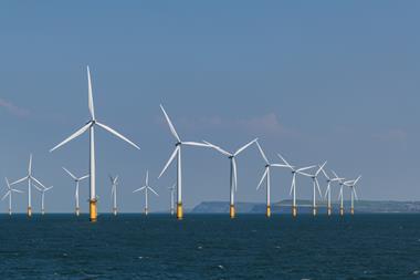 An image showing an offshore windmill farm
