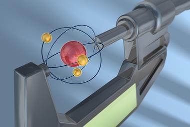 An illustration of an atom held in a clamp