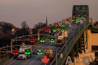 Tractor trailers and vehicles cross the Peace Bridge at the Canada-United States border in Fort Erie, Ontario, Canada